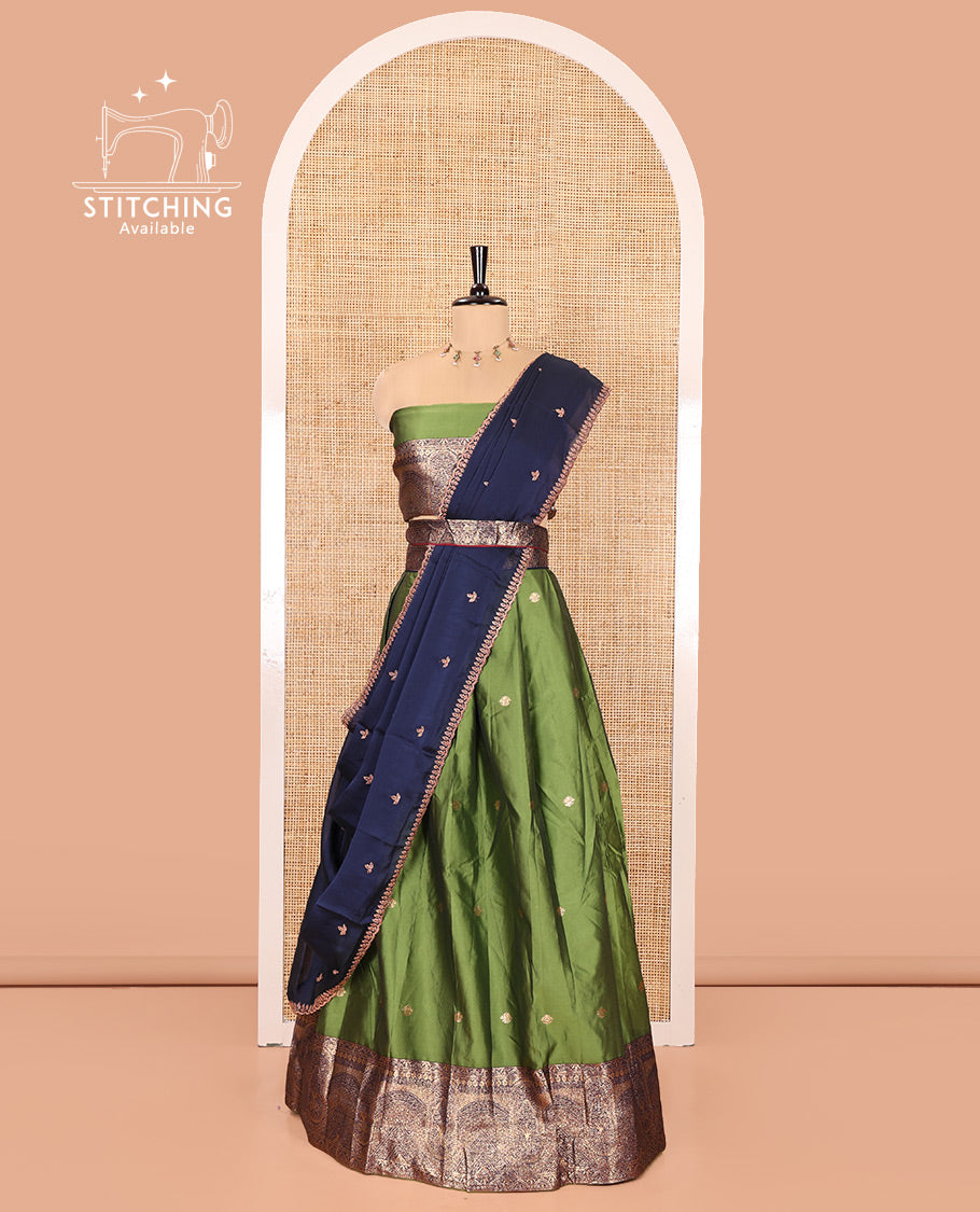 Leaf Green and Blue Semi-Banarasi Half-Saree, Beautifully Woven with Zari Buttas on Its Skirt, Complemented by a Contrast Geometric Patterns Zari Woven Border, Paired with a Matching Blouse, and a Contrast Satin Georgette Embroidered Scallop Dhavani