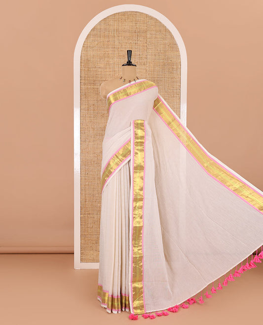 Cream Khadi mul cotton saree, contrast bavanji border, self-pallu with tassels, and a matching blouse
