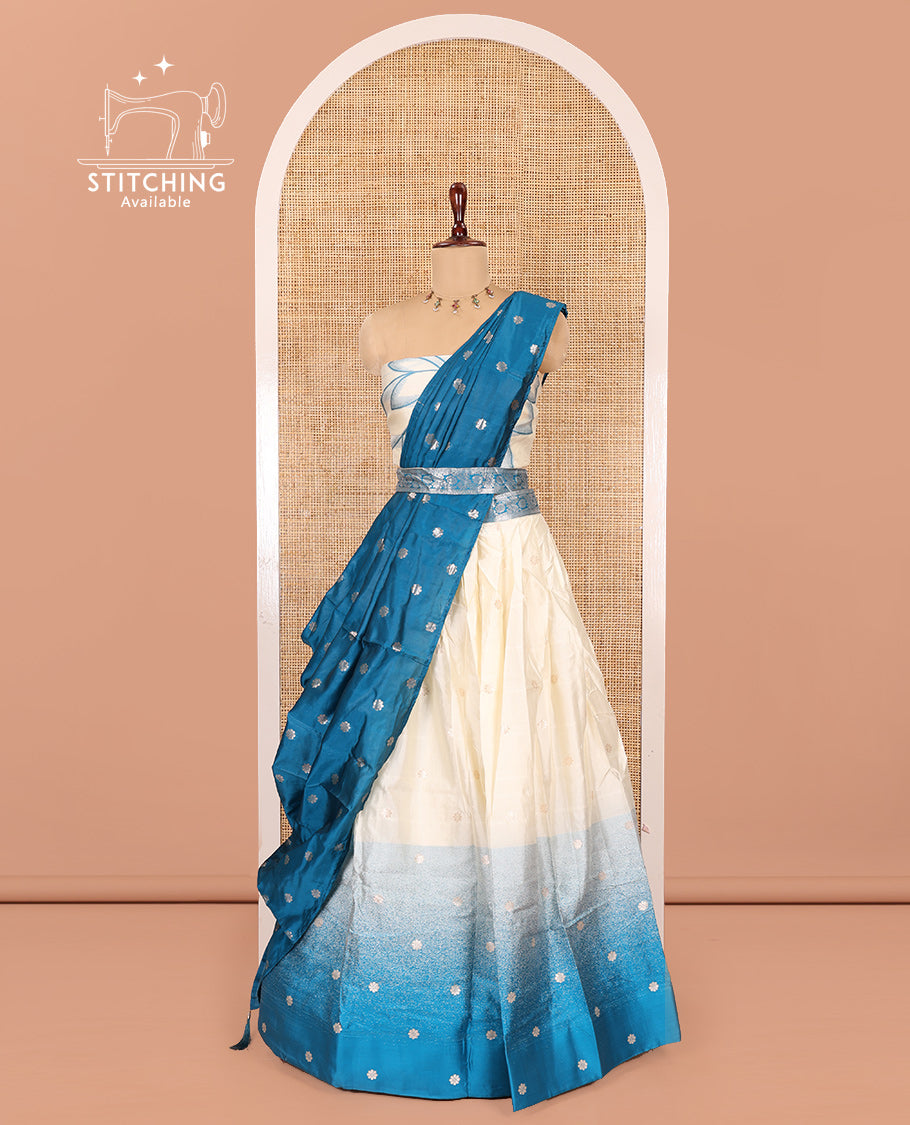 Cream-Rama Semi-Silk Half-Saree Features Flower Buttas Skirt, Contrast Border, Matching Blouse, Contrast Dhavani