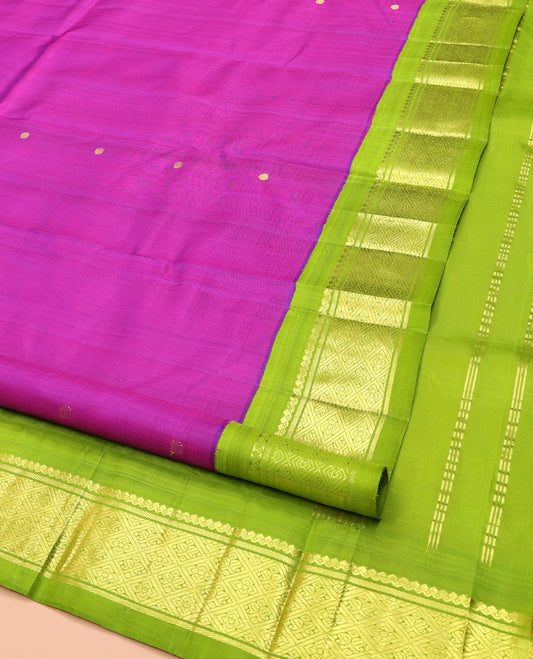 Rani Pink Kanchipuram Silk Saree, Woven with Zari Buttas on Its Body, Complemented by a Contrast One-Sided Korvai Border of Salngai, Banaras, and Jaal Designs, Pallu of Zari Designs, and Comes Without a Blouse