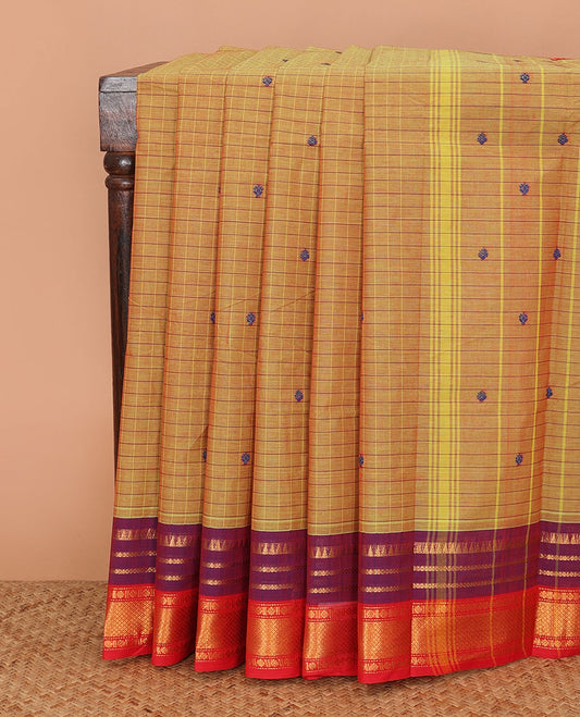 Mustard buttas, and checked Chettinad cotton saree, contrast temple traditional ganga jamuna border, and striped pallu