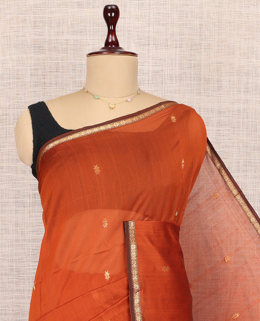 Orange Maheshwari Cotton Saree, Adorned with Buttas, a Subtle Contrast Piping Border, Pallu Gleamed Up with Zari Buttas, and a Contrast Blouse
