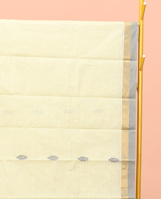 Pale Yellow Kanchi Cotton Saree, Woven with Buttas All Over Its Body, a Complemented by Contrast Border, Pallu of Intricate Designs, and Paired with a Matching Blouse