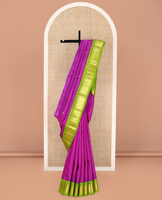 Rani Pink Kanchipuram Silk Saree, Woven with Zari Buttas on Its Body, Complemented by a Contrast One-Sided Korvai Border of Salngai, Banaras, and Jaal Designs, Pallu of Zari Designs, and Comes Without a Blouse