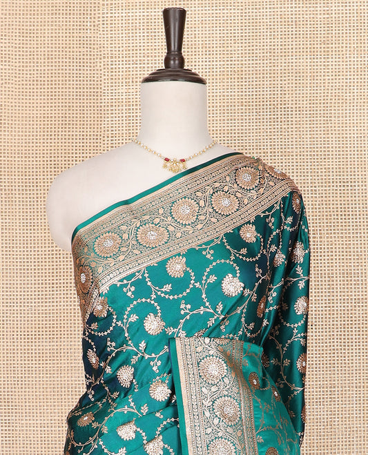 Green floral jaal jacquard banarasi silk saree, floral creeper stone border, and thilakam butta enclosed checked pallu
