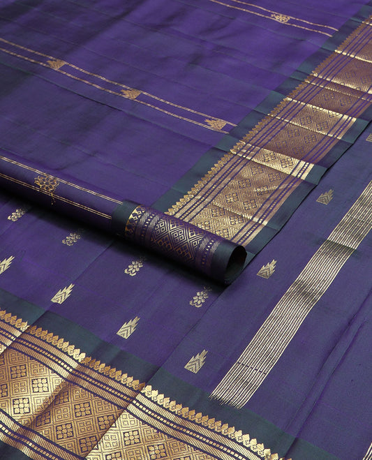 Blue thazampoo rekku buttas Kanchipuram silk saree, contrast one-sided border of thilakam mokku,muthu,banaras & jaal & zari design pallu