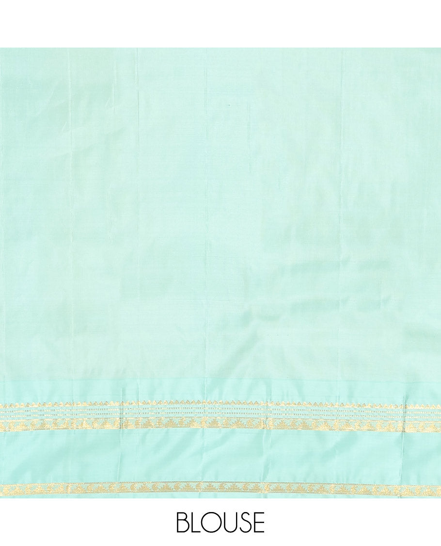 Purple Vasundhara Silk Saree, Spotlighted With Zari Buttas All Across Its Body, Complemented by Captivating Contrast Rettai Pettu Border of Thazampoo Rekku, Muthu, And Manga Designs, a Gleaming Zari Design Pallu, And Paired With a Contrast Blouse