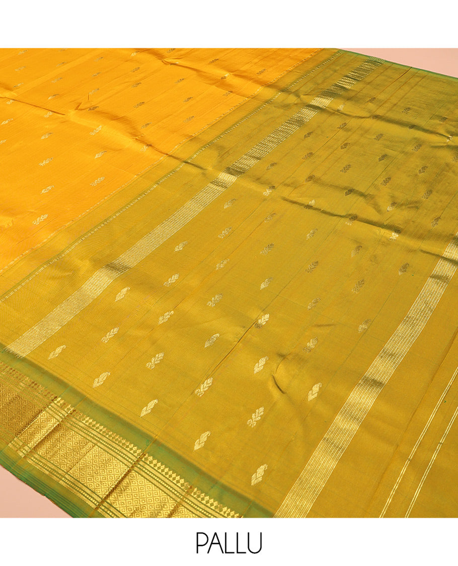 Yellow Kanchipuram Silk Saree Features Buttas, a Contrast One-Sided Border of Panner Sombu, Banaras, Muthu, and Mayil Kann Designs, Zari Design Pallu, and No Blouse
