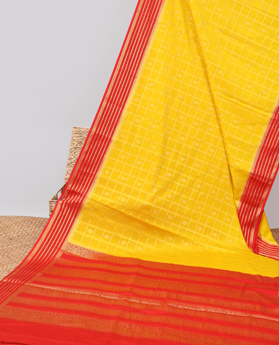 Yellow floral motifs enclosed with checked mysore silk saree with contrast striped zari border & pallu of intricate design