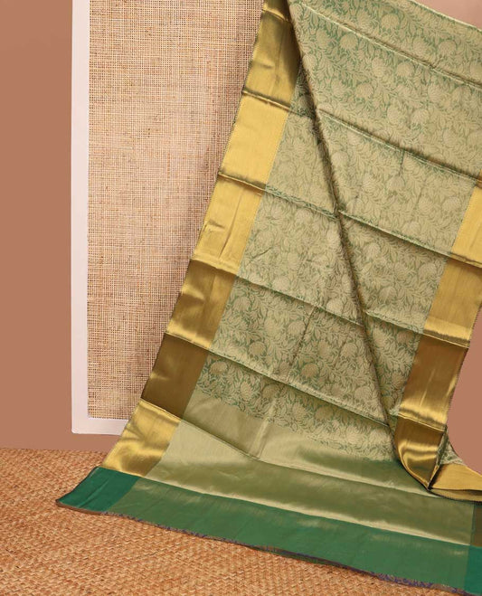 Green floral jacquard tissue saree with contrast striped border & zari design pallu