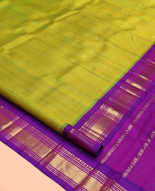 Green Kanchipuram Silk Saree, Detailed with Zari Buttas, Contrast Border of Paneer Sombu, Banaras, Muthu,and Mayil Kann, Zari Design Pallu, and No Blouse
