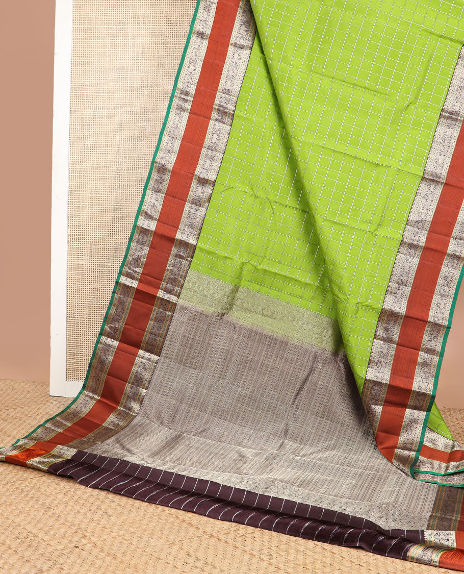 Green checked silk saree with contrast rettai pettu border of thilakam mokku, paun, muthu design & zari design pallu