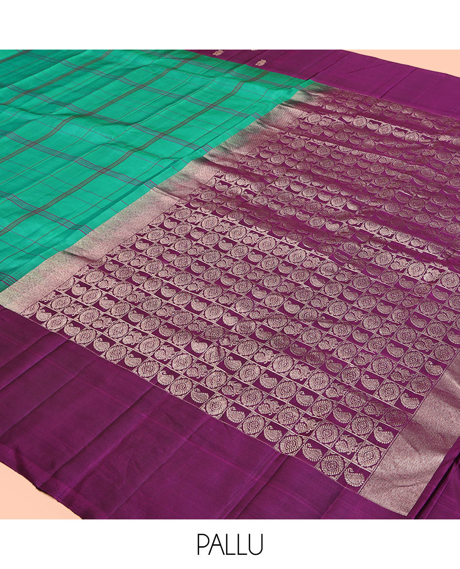 Green Checked Kanchipuram Silk Saree, Complemented by a Contrast Mayil-Chakram Border, Pallu of Butta Enclosed Checks, and a Contrast Blouse