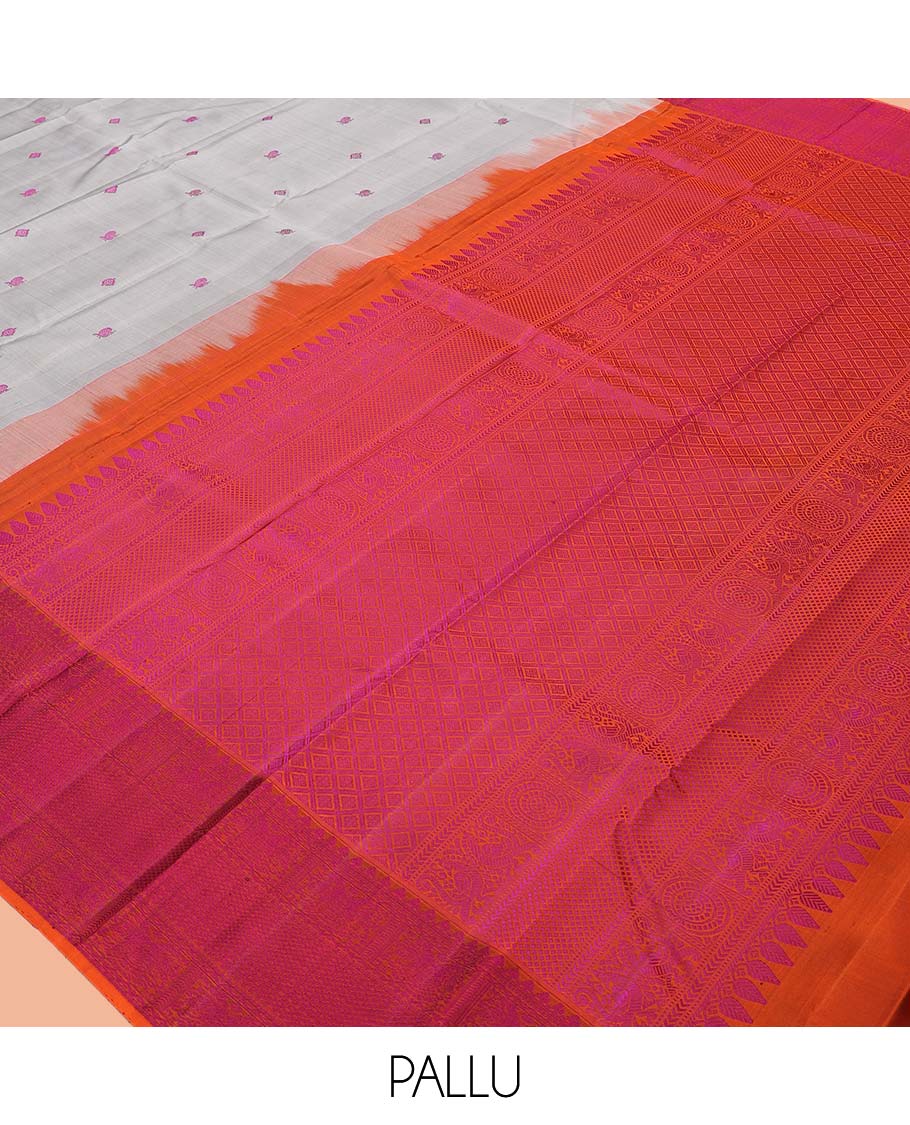 Grey Kanchipuram Silk Saree, Subtly Sparkled with Mayil-Chakram Buttas, a Contrast Border of Thilakam Mokku, Iruthalai Pakshi, and Kuyil Kann, Jaal Pallu, and a Contrast Blouse