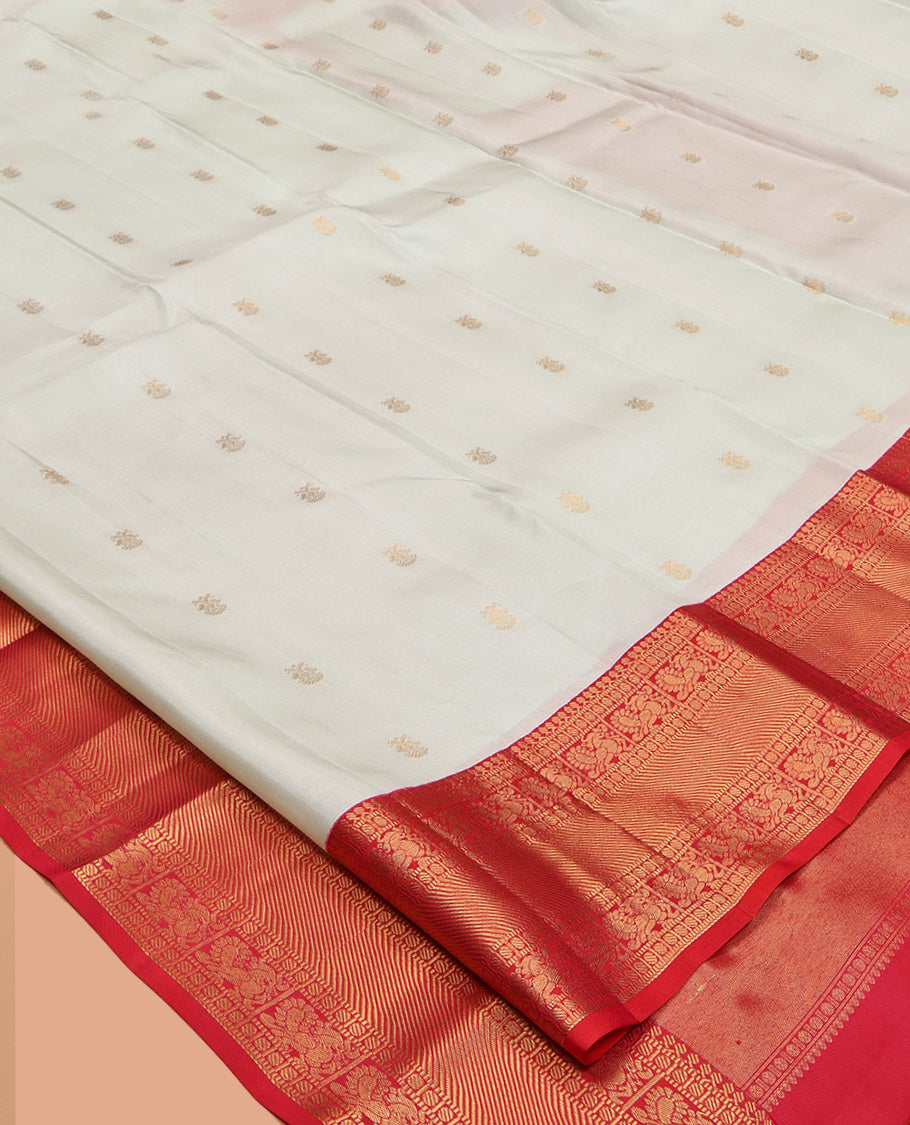 Off-White Vasundhara Lite-Silk Mix Saree, Enthralled with Iruthalai Pakshi Buttas, a Contrast Border of Thilakam Mokku, Muthu, Paisa, and Mayil Designs, Grand Pallu, and a Contrast Blouse