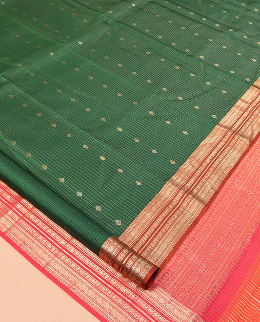 Green Vasundhara Silk Saree, Showcasing Zari Buttas and Checks, a Contrast Border of Thilakam, Kathir, Cross Kamalam, and Kodi Visiry Designs, Grand Pallu, and Contrast Blouse