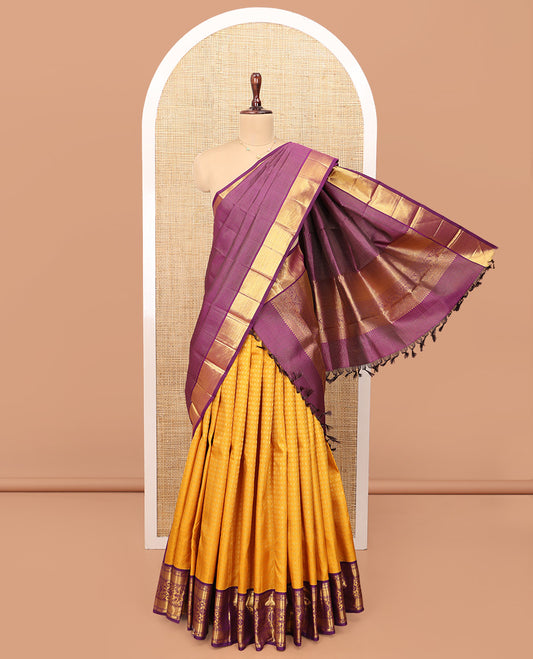 Yellow Pure Silk Half-Saree, Subtly Sparkled with Jacquard Design on Its Skirt, Complemented by a Contrast Zari Design Border, Comes with a Contrast Blouse and a Dhavani of Intricate Zari Weave