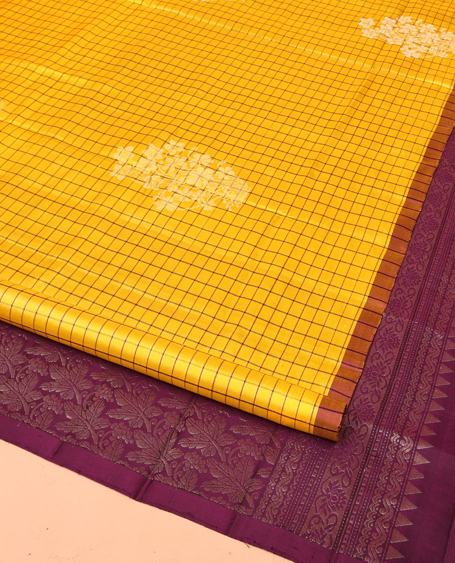 Yellow Mayuri Soft Silk Saree, Richly Detailed with Checks and Buttas All Over Its Body, Subtle Contrast Piping Border, Majestically Detailed Pallu of Leaf Designs, and Paired with a Contrast Blouse