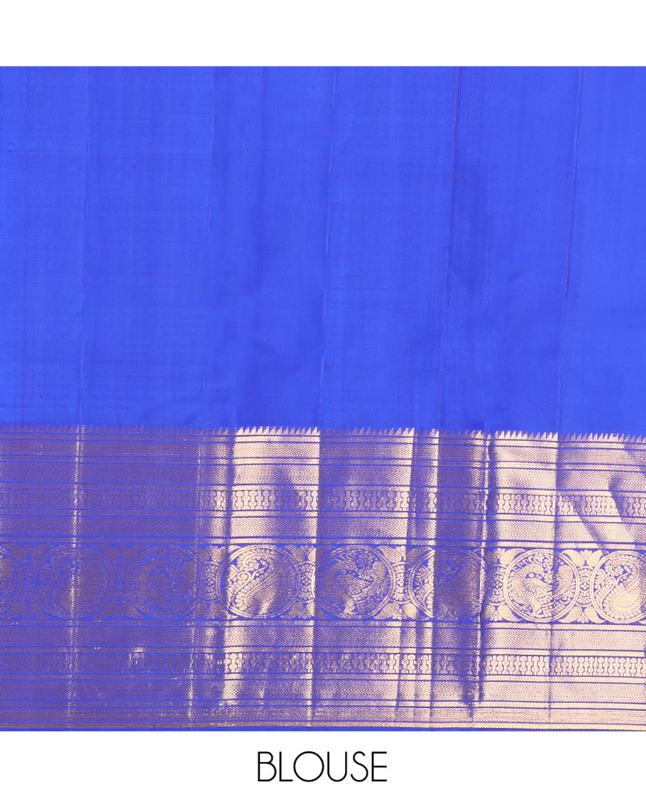Blue Kanchipuram Silk Saree, Bedecked with Zari Buttas All Over Its Body, Highlighted by a Zari Border of Rekku, Vanki, Round Mayil, and Poun Manga Designs, Pallu of Zari Designs, and Paired with a Matching Blouse
