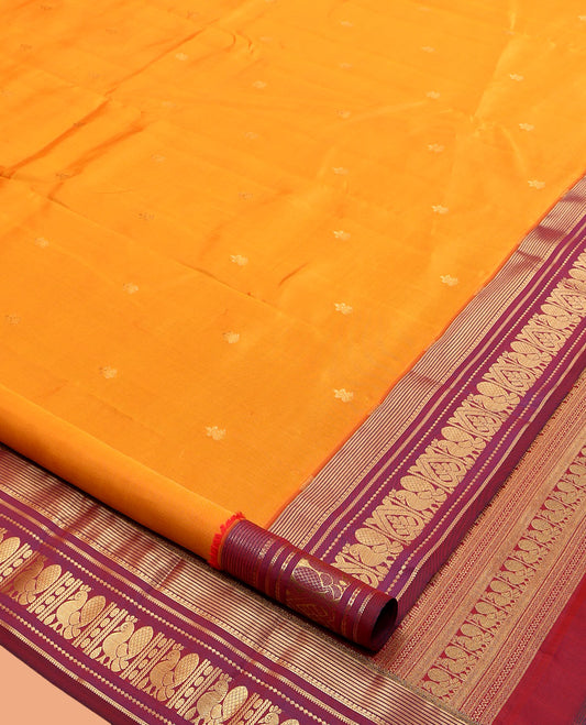 Orange Vasundhara Lite Silk Mix Saree, Gleamed Up with Zari Buttas, Contrast Border of Banaras, Banaras, Muthu, and Mayil Designs, Mayil Pallu, and a Contrast Blouse
