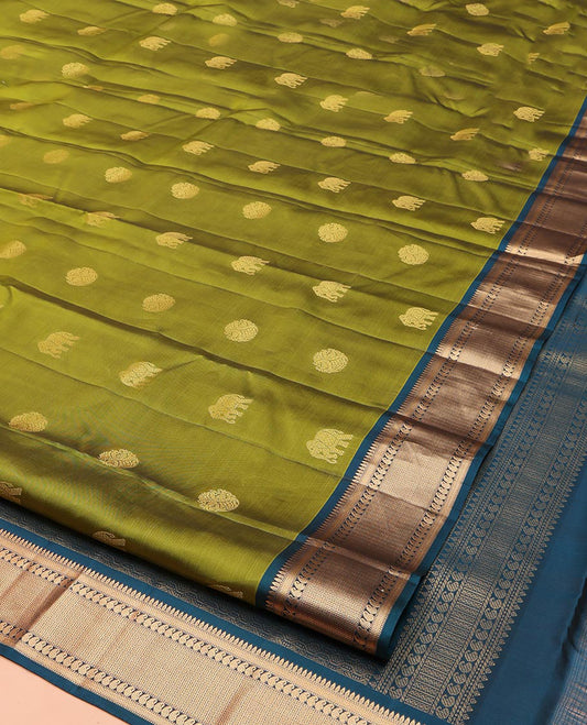Green Vasundhara Lite Silk Mix Saree, Elegantly Highlighted with Zari Buttas on Its Body, Complemented by a Contrast Border of Thilakam, Muthu, Mayil Kann, Neli, and Manga Designs, Grandly Woven Pallu, and Paired with a Contrast Blouse