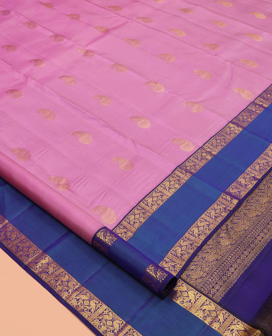 Pink Kanchipuram Silk Saree, Bedecked with Zari Buttas, a Contrast Korvai Rettai Pettu Border of Kili Designs, Butta Enclosed Checked Pallu, and a Contrast Blouse