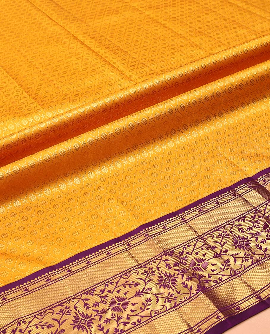 Yellow Pure Silk Half-Saree, Subtly Sparkled with Jacquard Design on Its Skirt, Complemented by a Contrast Zari Design Border, Comes with a Contrast Blouse and a Dhavani of Intricate Zari Weave