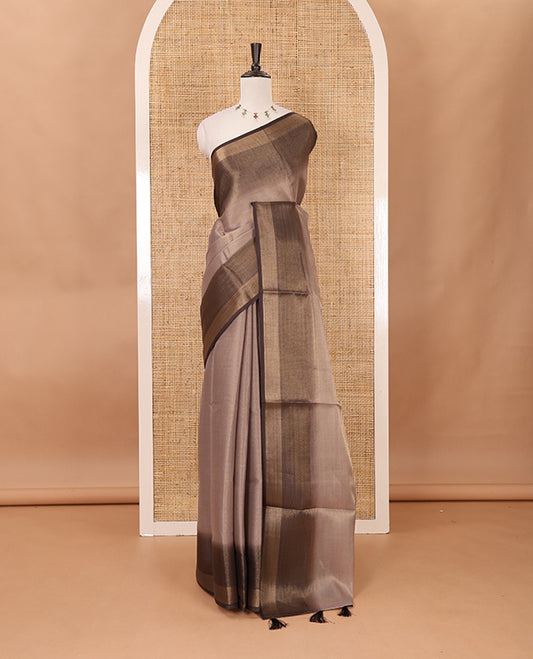 Brown plain tissue saree, contrast gold zari piping border & self pallu with tussels