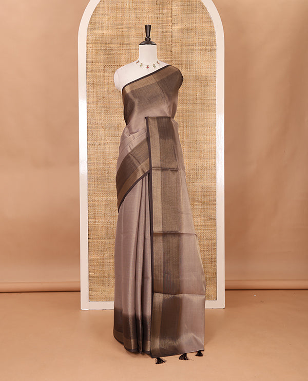 Brown plain tissue saree, contrast gold zari piping border & self pallu with tussels