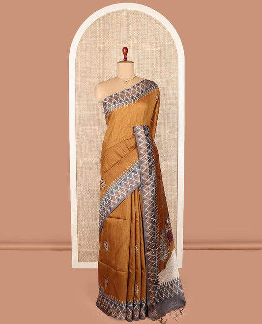 Mustard warli motifs tussar silk saree, contrast temple ikkat border, and pallu adorned with Madhubani human motifs