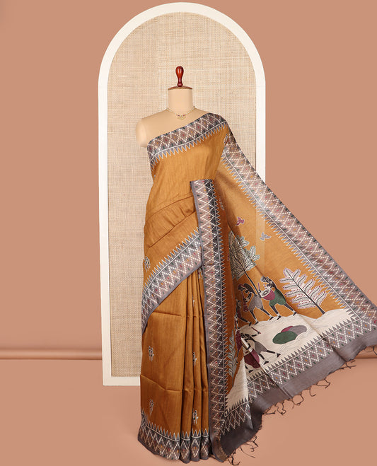 Mustard warli motifs tussar silk saree, contrast temple ikkat border, and pallu adorned with Madhubani human motifs