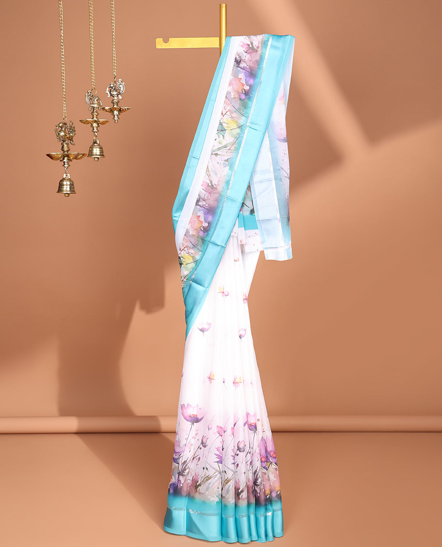 White digital floral design moss chiffon saree with contrast blue zari border & floral design pallu