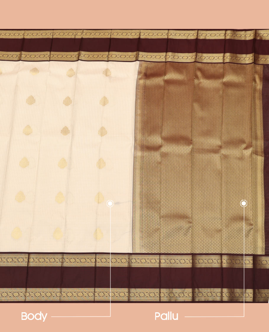 Cream Budget Silk Saree, Entralled with Zari Buttas and Checks On Its Body, Complemented by Contrast Rettai Pettu Border of Traditional Zari Designs, Grand Jaal Pallu and Paired with a Contrast Blouse