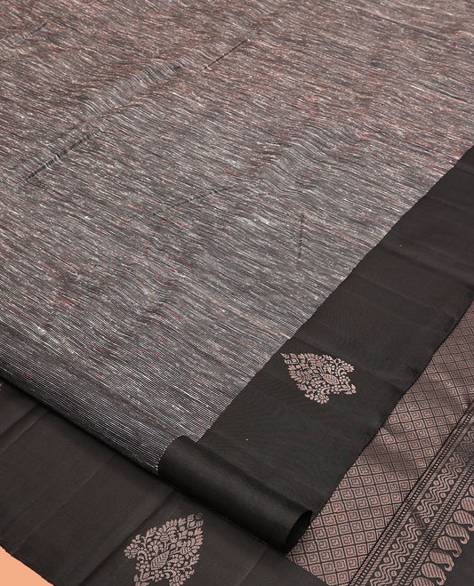Black Kanchipuram Silk Saree, Decked Up with Ikat-Style Stripes, Highlighted By Floral Buttas Border, Grand Jaal Pallu, and a Matching Blouse
