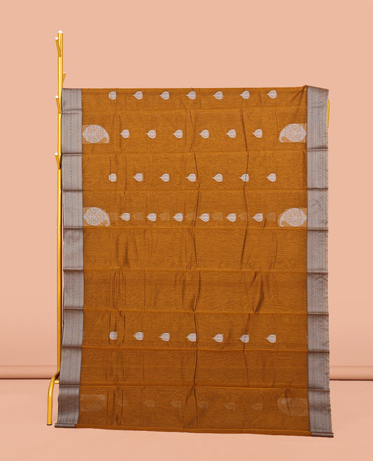 Mustard Semi-Silk Cotton Saree, Delicately Designed with Buttas All Over Its Body, Traditional Design Border of Paisleys, Geometric-Patterned Pallu, and Paired with a Matching Blouse