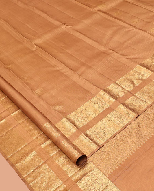 Pale Brown Kanchipuram Silk Saree, Subtly Sparkled with Zari Designs, Highlighted by a Zari Rettai Pettu Border of Poun, Mayil, and Kuthirai Designs, Grand Pallu, and Matching Blouse