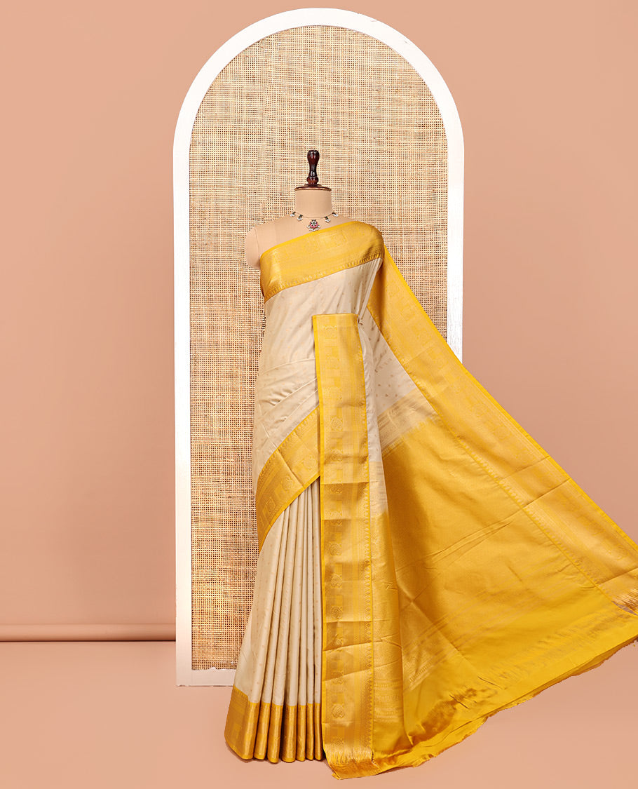 Biscuit-Yellow Budget Silk Saree, Subtly Sparkled with Zari Buttas, a Contrast Traditional Zari Border, Grand Pallu, and a Contrast Blouse