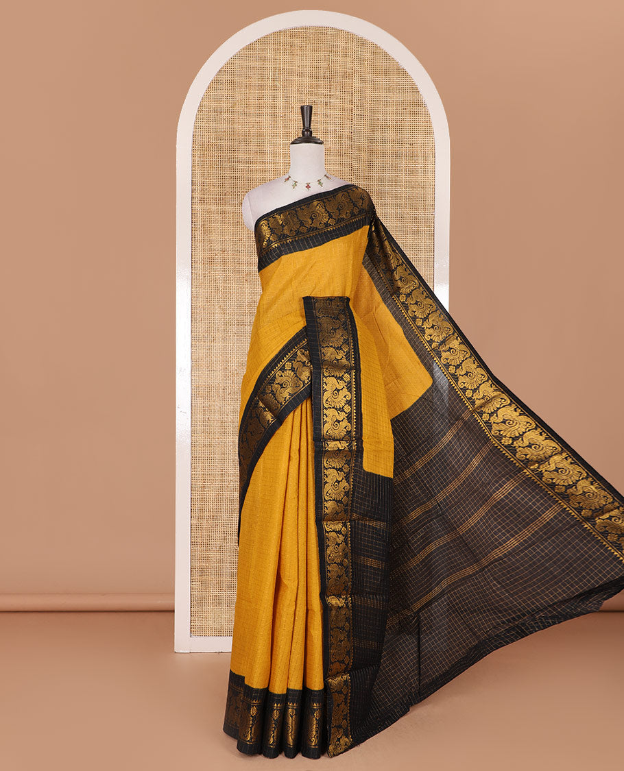 Mustard zari checked Sungudi cotton saree, contrast peacock motif border, zari striped pallu, and contrast zari design blouse