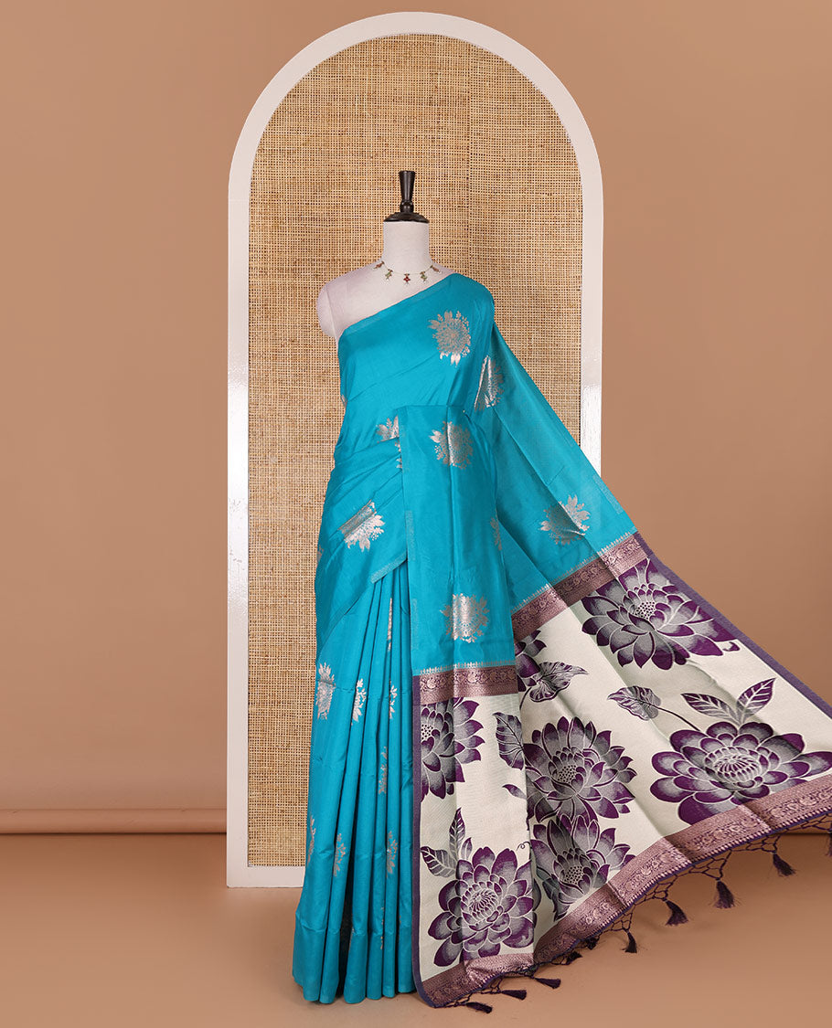 Borderless rama blue floral motifs steeped elite soft silk saree, contrast lotus-like motifs pallu, and contrast buttas blouse