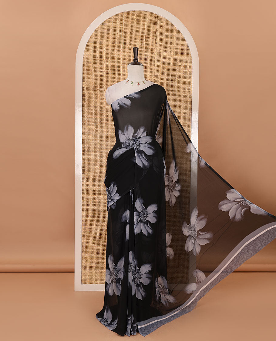 Borderless black big floral motifs printed georgette saree with contrast printed blouse