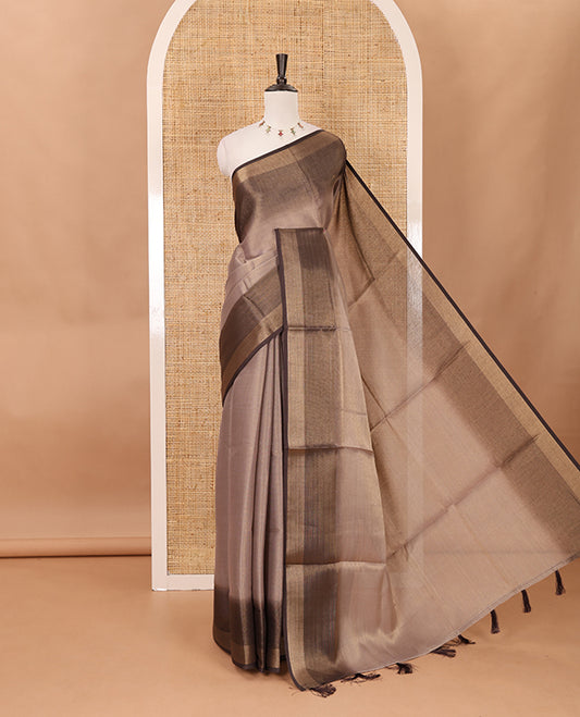 Brown plain tissue saree, contrast gold zari piping border & self pallu with tussels