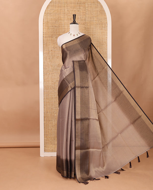 Brown plain tissue saree, contrast gold zari piping border & self pallu with tussels