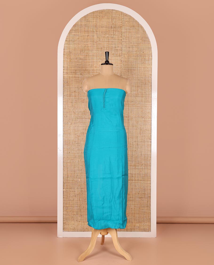 Blue material chudidar set, plain with pom-pom tasseled mul chanderi top, a matching bottom, and organza dupatta of stripes