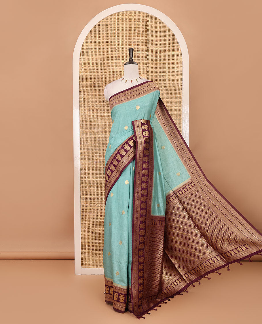 Sea blue peacock buttas dola silk saree, contrast rudraksham & iruthalai pakshi border, intricate pallu & contrast jacquard blouse