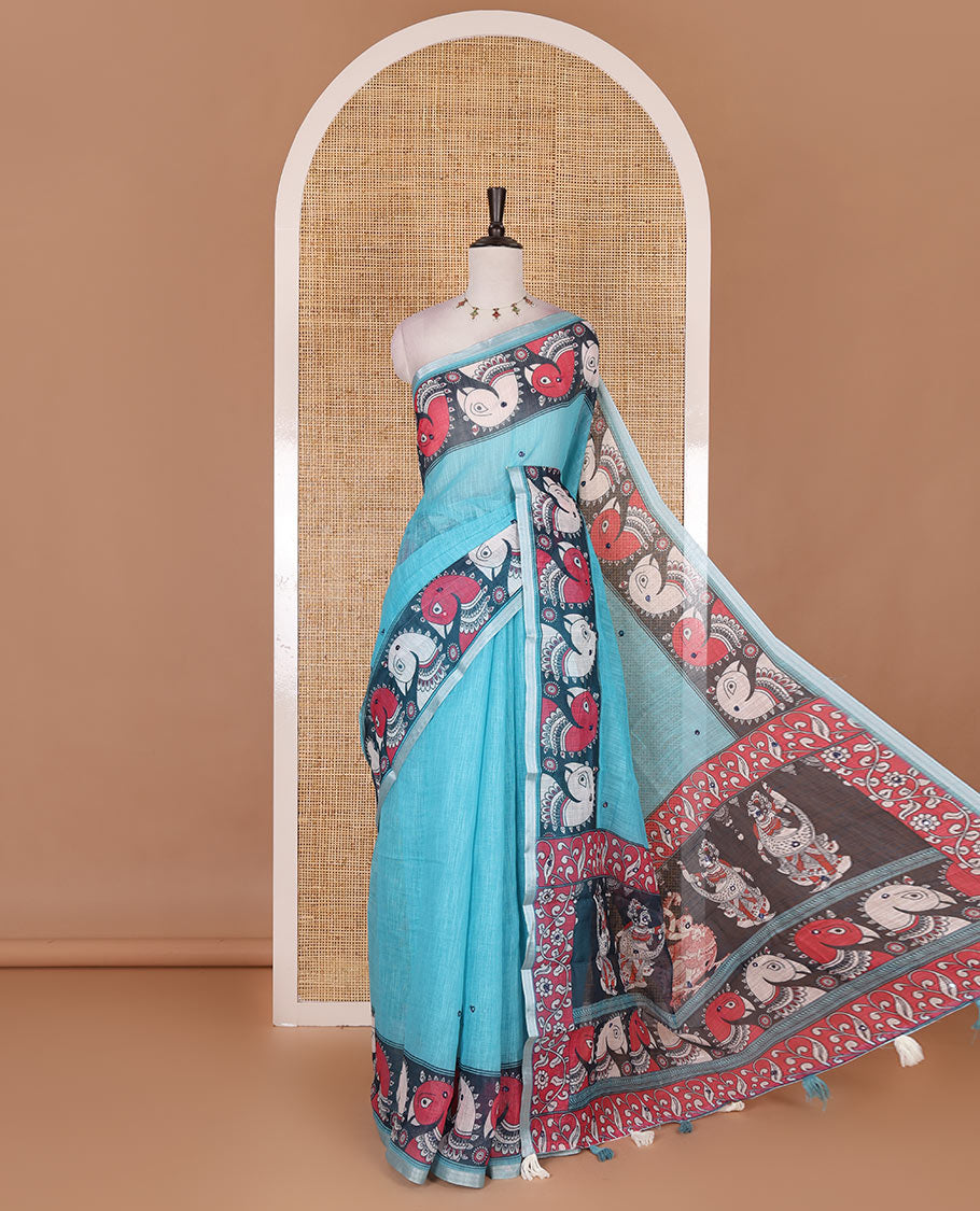 Blue mirror thread embroidered linen saree, contrast kalamkari peacock printed border, pallu of kalamkari peacock and human figurines print, and printed blouse