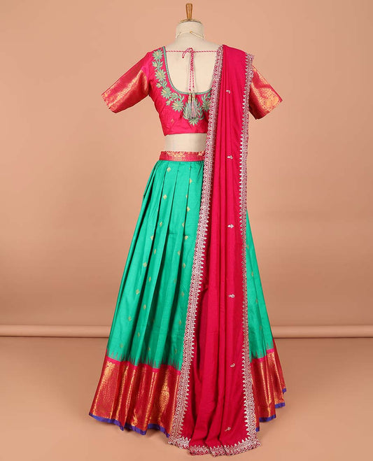 Green buttas semi-stitched half saree with contrast zari border,  embroidered blouse & scallop border dhavani