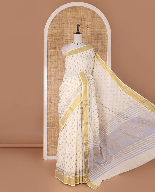 Cream manga butta golden foil printed Kerala cotton saree, zari border, pallu of paisley motifs, and a matching blouse