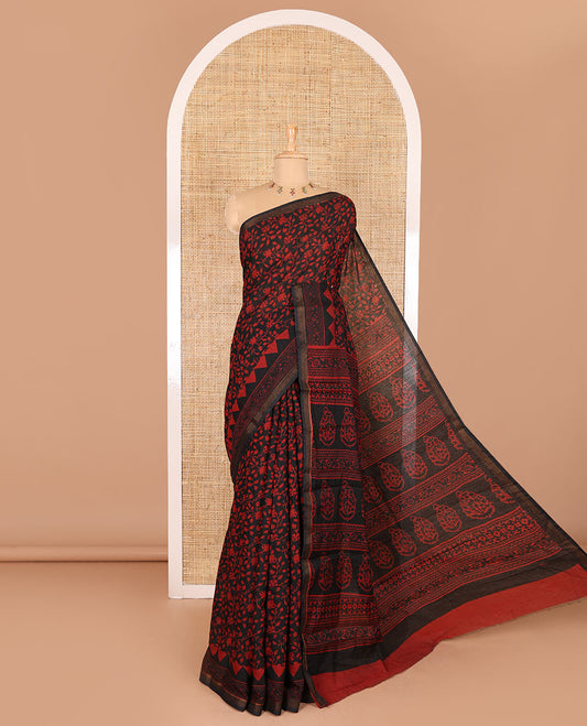Black floral vine hand block printed Chanderi cotton saree with temple border of print, and piping zari work, printed pallu, and a zig-zag striped blouse