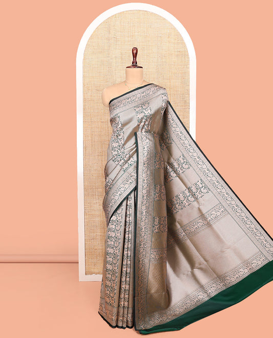 Green Semi-Banaras Silk Saree, Finely Designed with Animal-themed Jacquard Designs on Its Body, Highlighted by a Zari Border of Traditional Designs, Pallu Steeped with Stripes, and Paired with a Matching Blouse