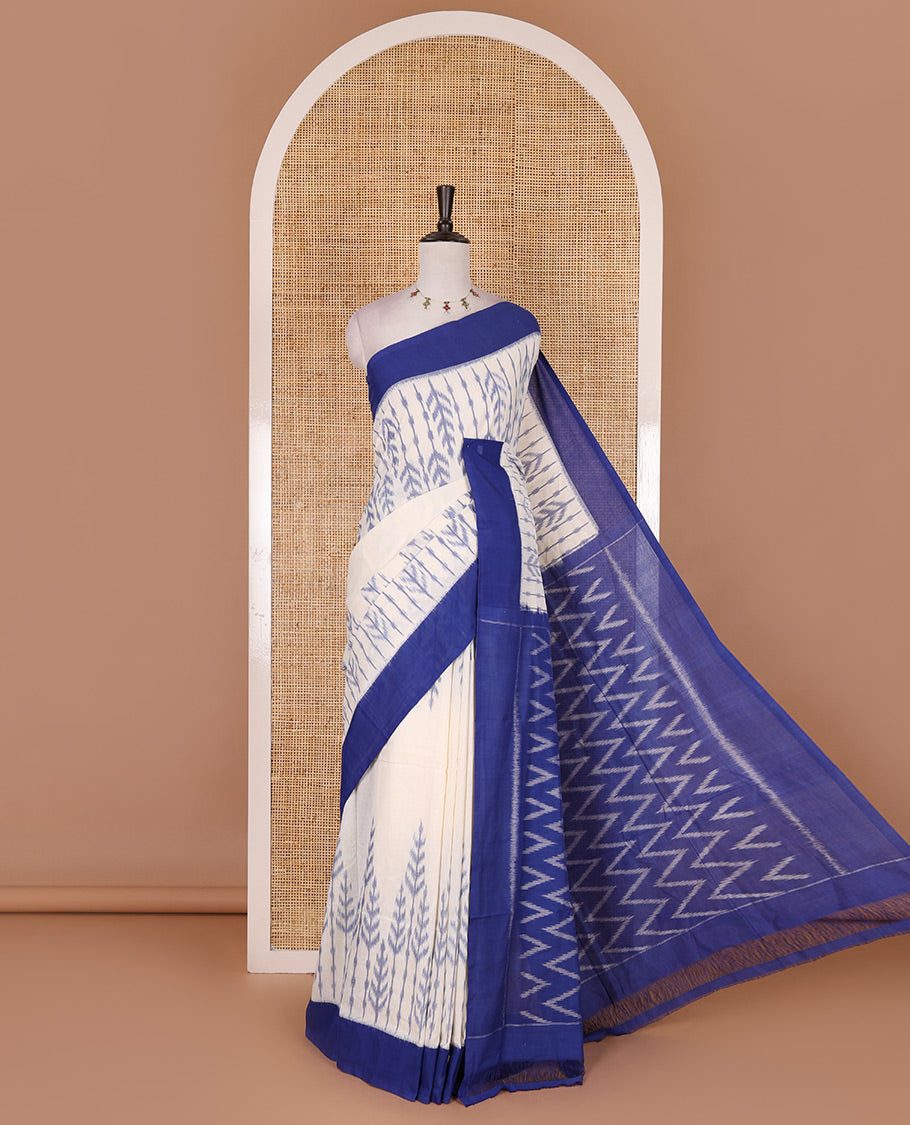 Half white leaf design ikkat cotton saree, contrast plain border,  ikkat chevron pallu, and contrast plain blouse